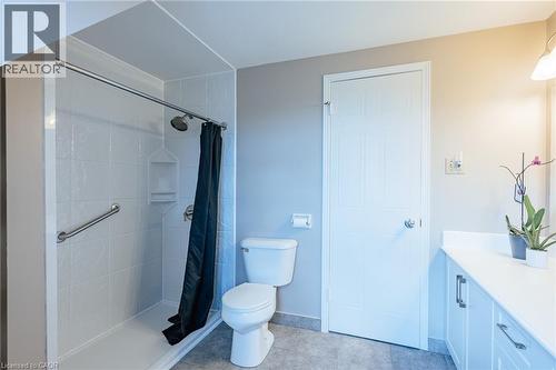 Walk-in shower with grab bar and tiled walls - 28 Mcgibbon Court, Kitchener, ON 