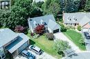 Two-story residence with a gray shingle roof and three dormer windows - 28 Mcgibbon Court, Kitchener, ON 