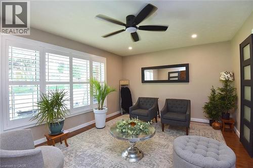 Living area featuring wood-finish flooring, recessed lighting, and a ceiling fan - 8 Sheridan Boulevard, Simcoe, ON 