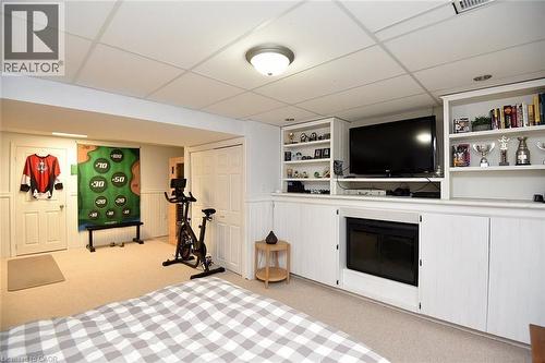 Recreational room featuring carpet flooring, drop ceiling, and recessed lighting - 8 Sheridan Boulevard, Simcoe, ON 