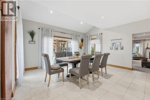 Dining area featuring light-toned tile flooring, a vaulted ceiling, and recessed lighting - 271 Windham Rd 14, Simcoe, ON 