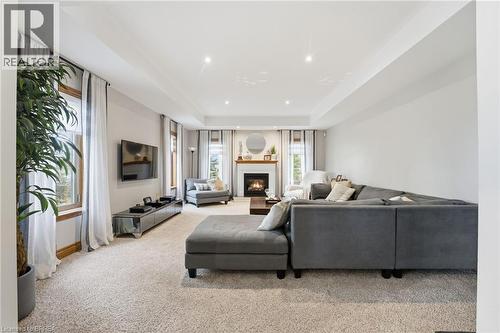 Spacious living area featuring neutral carpeting and recessed lighting - 271 Windham Rd 14, Simcoe, ON 