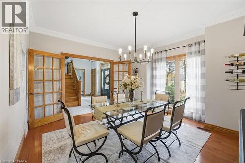 Dining area featuring wood-finish flooring and crown molding - 271 Windham Rd 14, Simcoe, ON 