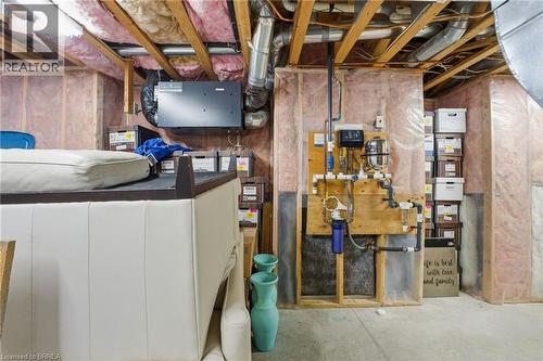 Unfinished basement showcasing exposed wood framing, ceiling joists, and ductwork - 271 Windham Rd 14, Simcoe, ON 