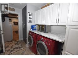 laundry area with plenty of storage - 
