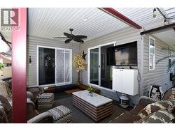 covered patio with access from the kitchen and the primary - 