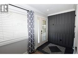 inside the front door. Beautiful cabinetry and a tiled floor - 
