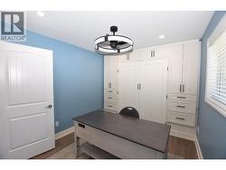 built in shelving and a space to fit a queen sized bed when the shelving doors are open - 