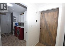 a barn door separates the bedrooms from the main area - 