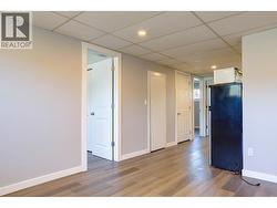 Living room towards from bedroom in basement suite - 