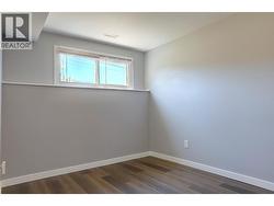Front bedroom in basement suite. - 