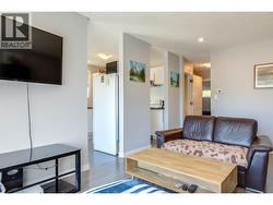 Living room on main floor towards kitchen. - 