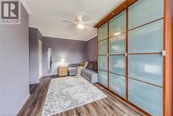 Built-in wardrobe with frosted glass panels and wood-finish framing - 
