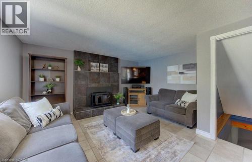 14 Rose Garden Street, Kitchener, ON - Indoor Photo Showing Living Room With Fireplace