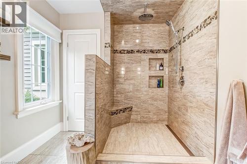 Primary ensuite features a large walk in, tiled shower and linen closet - 59 Decou Road, Simcoe, ON 