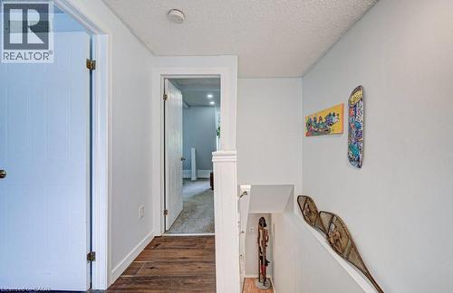 Hallway featuring wood-finish flooring and light-colored walls - 854 Elgin Street N, Cambridge, ON 