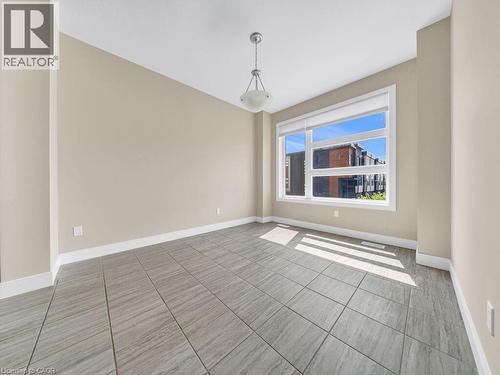 Neutral tone walls with white trim - 60 Arkell Road Unit# 51, Guelph, ON 