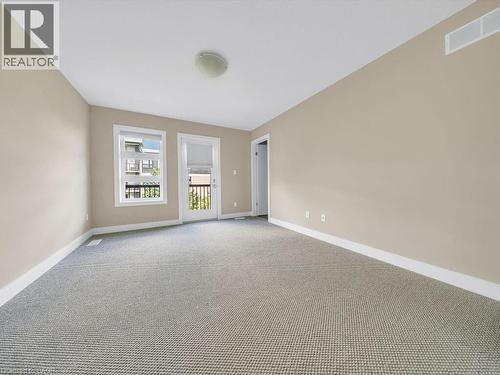 Neutral-toned walls complement the light gray textured carpeting - 60 Arkell Road Unit# 51, Guelph, ON 