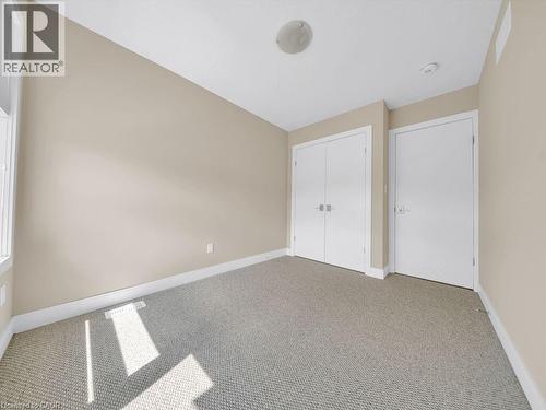 Neutral-toned walls complement the light gray carpet flooring - 60 Arkell Road Unit# 51, Guelph, ON 