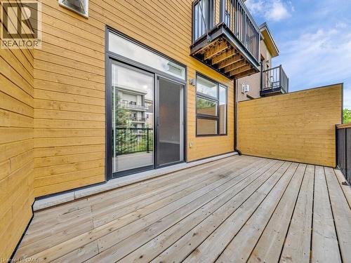 Exterior wood deck with horizontal wood plank siding - 60 Arkell Road Unit# 51, Guelph, ON 