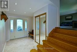 Foyer with Coat Room and Garage Access - 