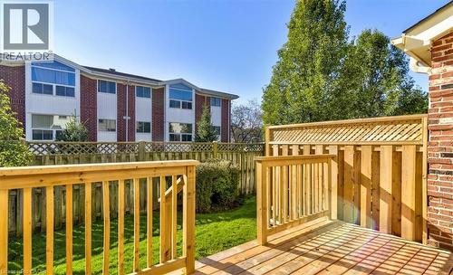 Your private backyard deck offers space for relaxing, while the small yard is perfect for easy upkeep. - 42 Donly Drive S Unit# 2, Simcoe, ON 
