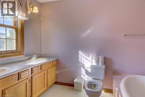 Your private ensuite bathroom features a full tub and double vanity—perfect for morning routines. - 42 Donly Drive S Unit# 2, Simcoe, ON 