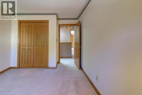 Upper Bedroom 2: Ample storage in the closet makes organizing easy in this comfortable upstairs bedroom. - 42 Donly Drive S Unit# 2, Simcoe, ON 