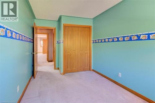Upper Bedroom 3:  closet provides practical storage for clothing, shoes, and seasonal items. - 42 Donly Drive S Unit# 2, Simcoe, ON 