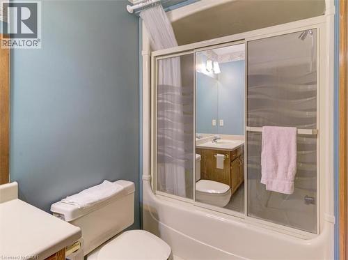 The upstairs 4 piece bathroom features a tub and shower combination, perfect for both a quick rinse or a relaxing soak. - 42 Donly Drive S Unit# 2, Simcoe, ON 
