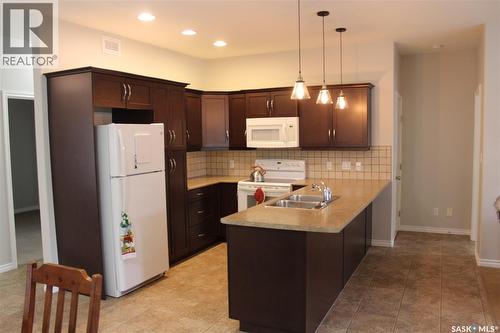 108 Erickson Street, Midale, SK - Indoor Photo Showing Kitchen With Double Sink
