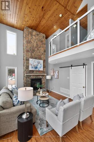 Family Room - 10 Musquake Court, Tiny, ON - Indoor Photo Showing Living Room With Fireplace