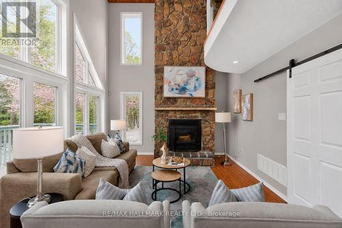 Family Room - 10 Musquake Court, Tiny, ON - Indoor Photo Showing Living Room With Fireplace