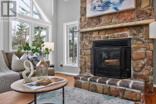 Family Room - 10 Musquake Court, Tiny, ON - Indoor Photo Showing Living Room With Fireplace