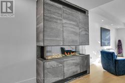 (3-sided gas fireplace with imported tile facade) - 