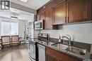 302 320 5Th Avenue N, Saskatoon, SK  - Indoor Photo Showing Kitchen With Stainless Steel Kitchen With Double Sink 