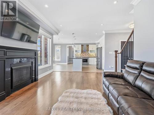 17 Mount Crescent, Essa, ON - Indoor Photo Showing Living Room With Fireplace