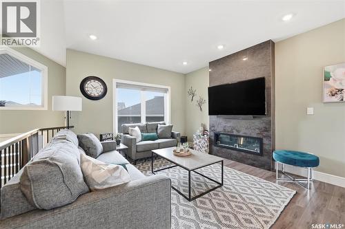 211 Burgess Bay, Saskatoon, SK - Indoor Photo Showing Living Room With Fireplace