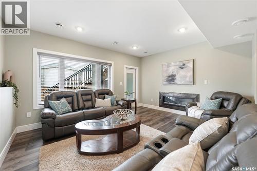211 Burgess Bay, Saskatoon, SK - Indoor Photo Showing Living Room With Fireplace