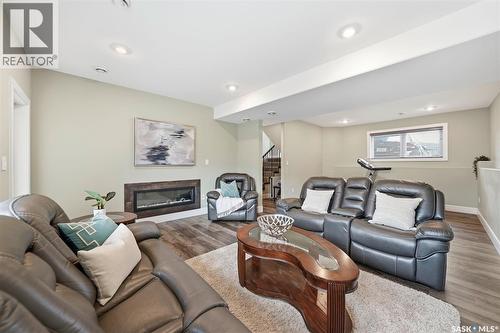 211 Burgess Bay, Saskatoon, SK - Indoor Photo Showing Living Room With Fireplace