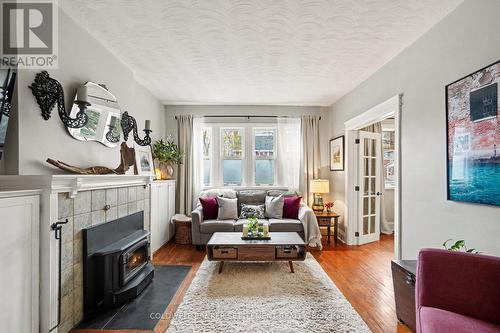 Gorgeous living room with French doors. - 1 Burchell Boulevard, Perth, ON - Indoor Photo Showing Living Room With Fireplace
