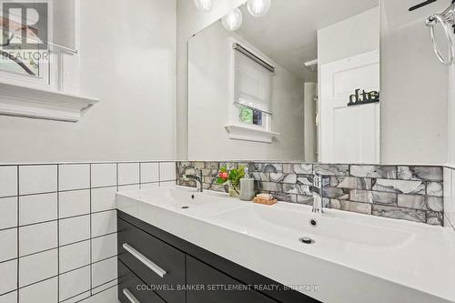 Renovated main bathroom with double vanity. - 1 Burchell Boulevard, Perth, ON - Indoor Photo Showing Bathroom