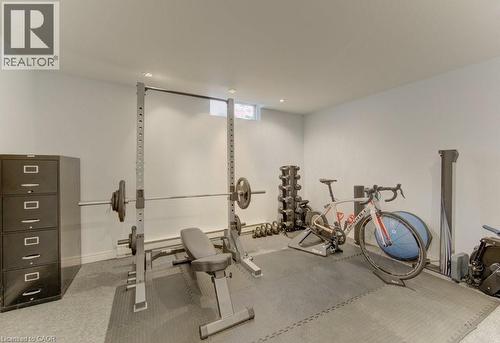 Finished room featuring light-colored walls and recessed lighting - 108 Clearwater Crescent, Waterloo, ON - Indoor Photo Showing Gym Room