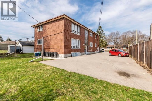 Two-story brick exterior building with multiple windows - 43 Sixth Avenue, Kitchener, ON - Outdoor
