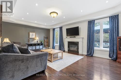 Large Family Room with Coffered Ceilings - 555 Kingsfield Loop, Oshawa, ON - Indoor Photo Showing Living Room With Fireplace