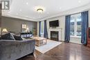 Large Family Room with Coffered Ceilings - 555 Kingsfield Loop, Oshawa, ON  - Indoor Photo Showing Living Room With Fireplace 