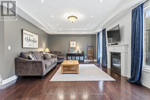 Fireplace and Hardwood Floors - 555 Kingsfield Loop, Oshawa, ON - Indoor Photo Showing Living Room With Fireplace