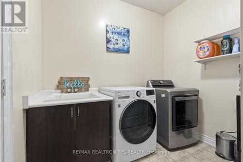Laundry with Access to Garage - 555 Kingsfield Loop, Oshawa, ON - Indoor Photo Showing Laundry Room