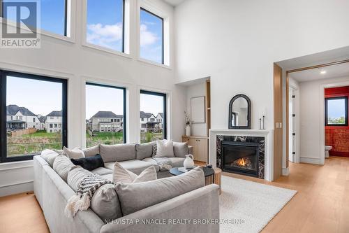 Open to Above Living room - 4108 Fallingbrook Road, London South (South V), ON - Indoor Photo Showing Living Room With Fireplace