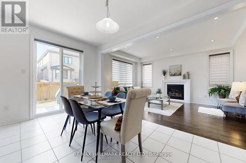 9 Lyle Way E, Brampton, ON - Indoor Photo Showing Dining Room With Fireplace